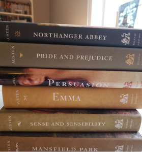 Stack of the annotated editions of Jane Austen's six novels: Northanger Abbey, Pride and Prejudice, Sense and sensibility, Emma, Mansfield Park, and Persuasion.